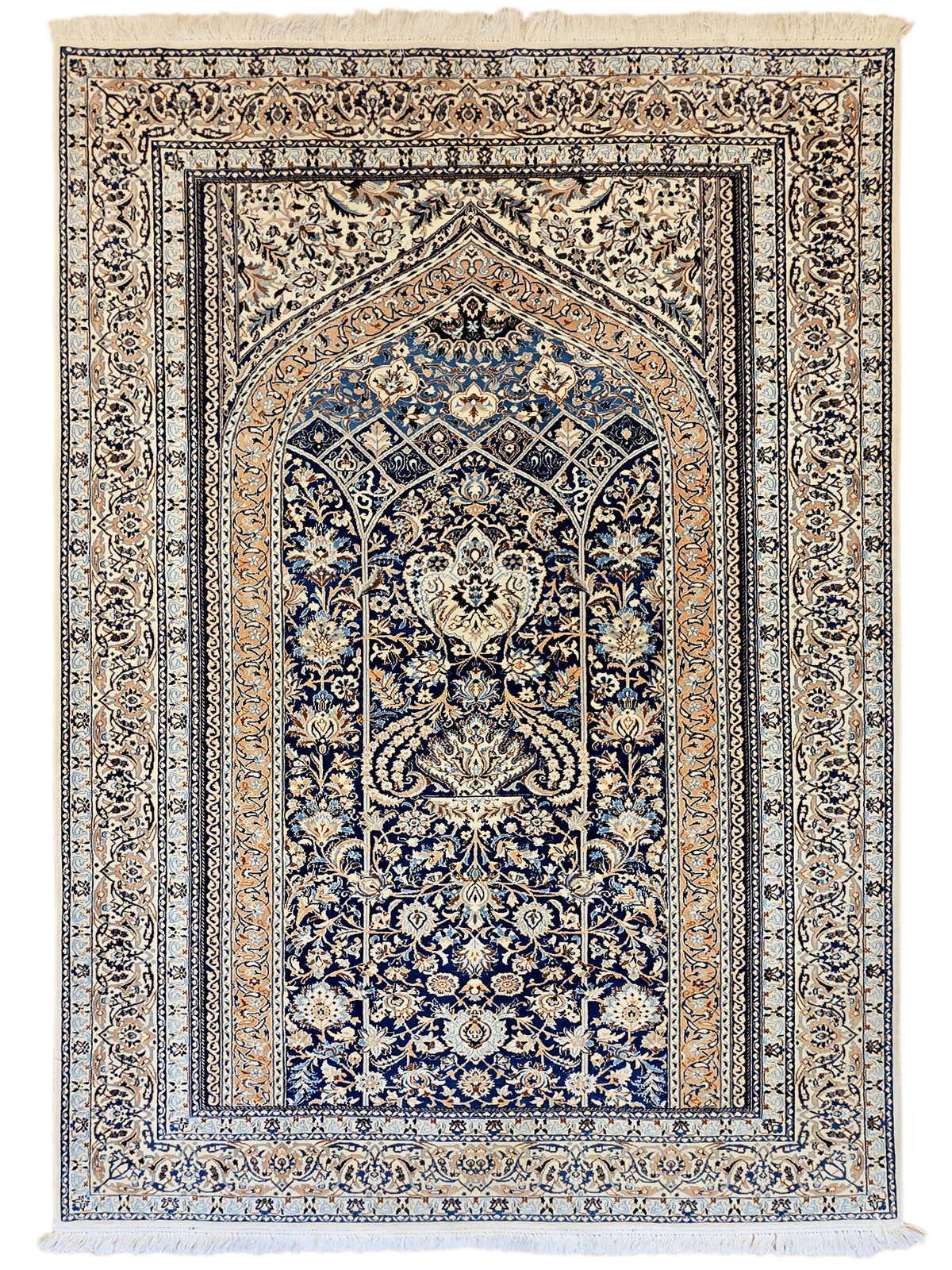 Blue and cream medallion area rug with detailed motifs and fringed edges