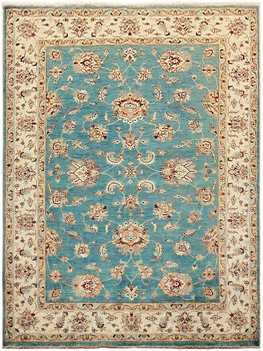 Turquoise oriental-style rug with cream ornate border and central medallion, fringed edges