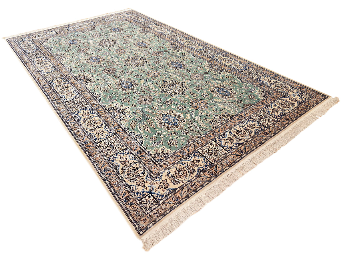 Nain rug angled view with teal center, navy floral accents, and cream fringe ends