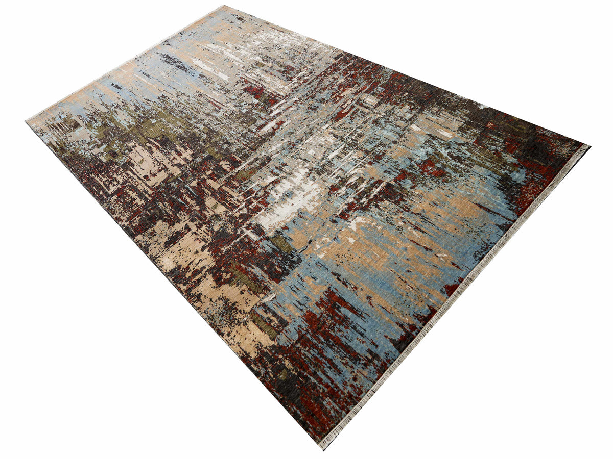 Abstract area rug with distressed beige, blue and rust sections; flat woven texture.