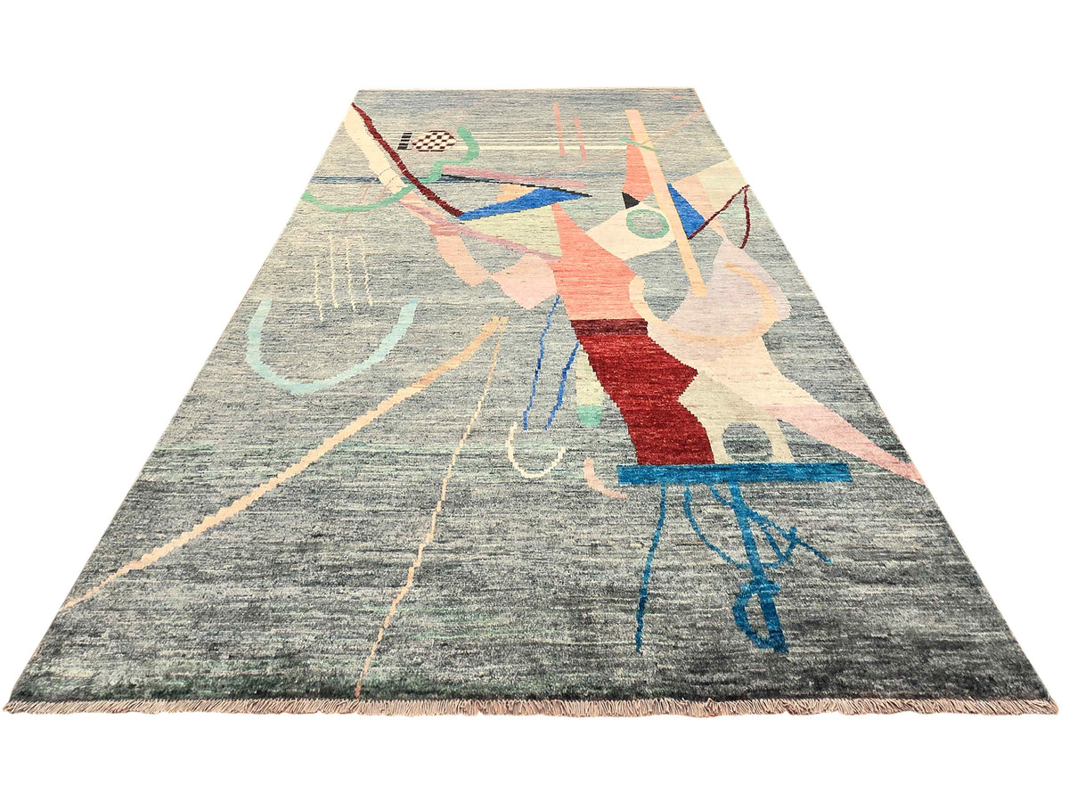 Abstract patterned rug with flowing lines and blocks in red, blue, and beige on gray