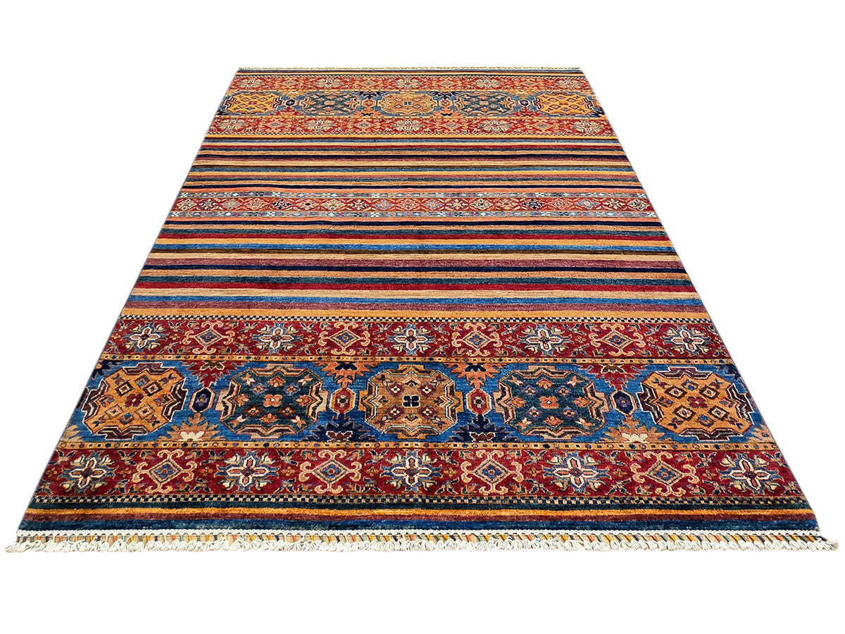 Rectangular woven area rug with bold central medallion and striped border in multicolor tones