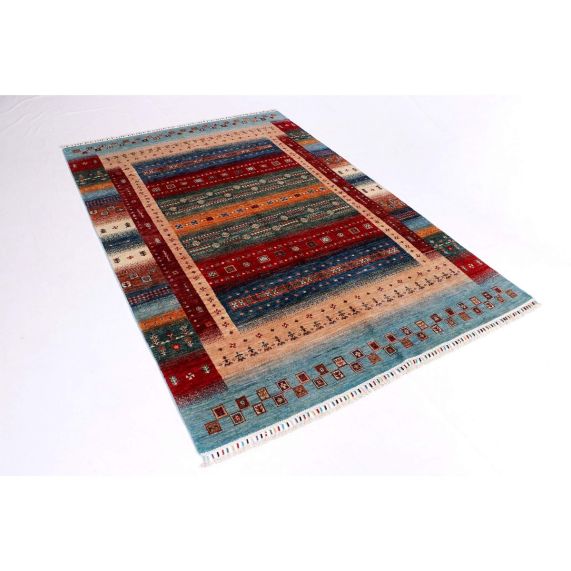 Gabbeh-style rug corner view with stacked bands in red, blue, teal, and beige