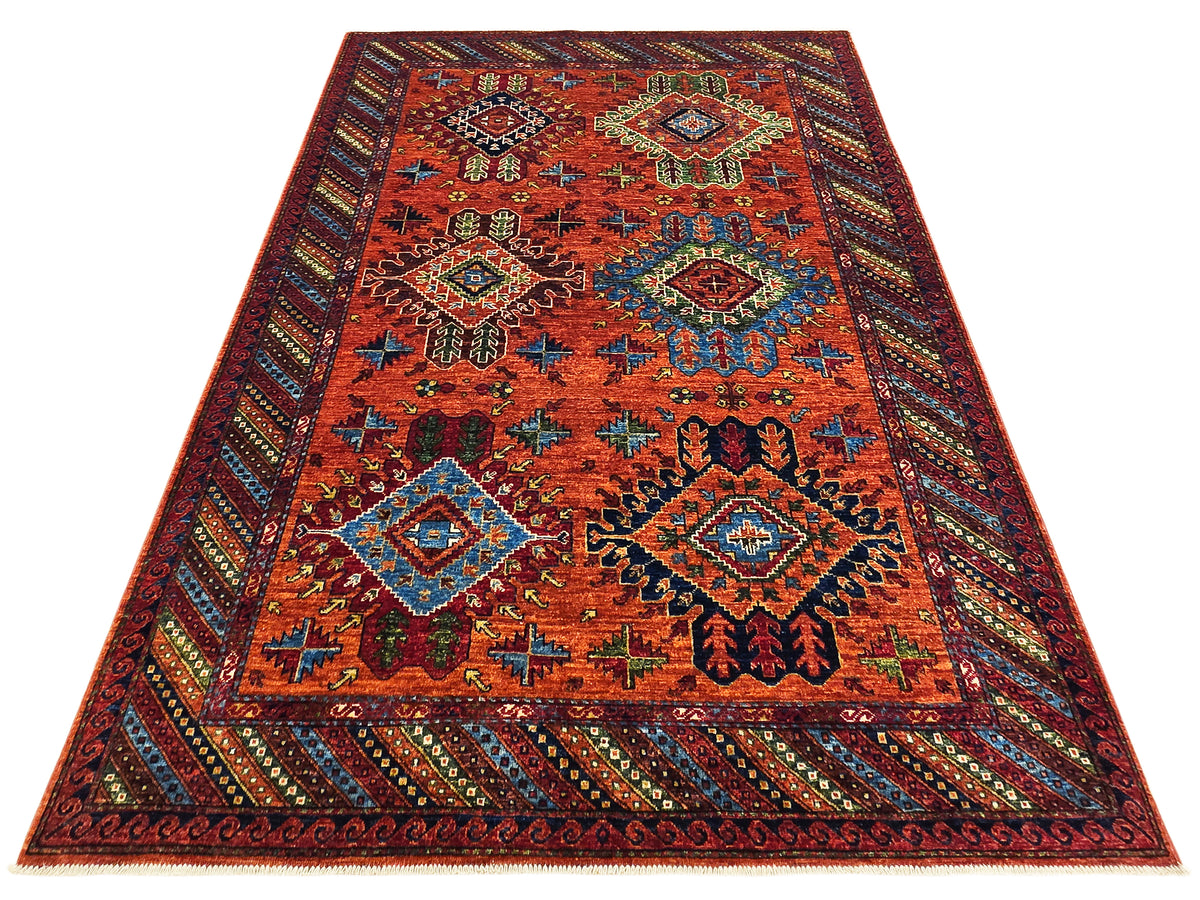 Overhead view of 245x172 cm rug with red-orange geometric pattern and corner medallions