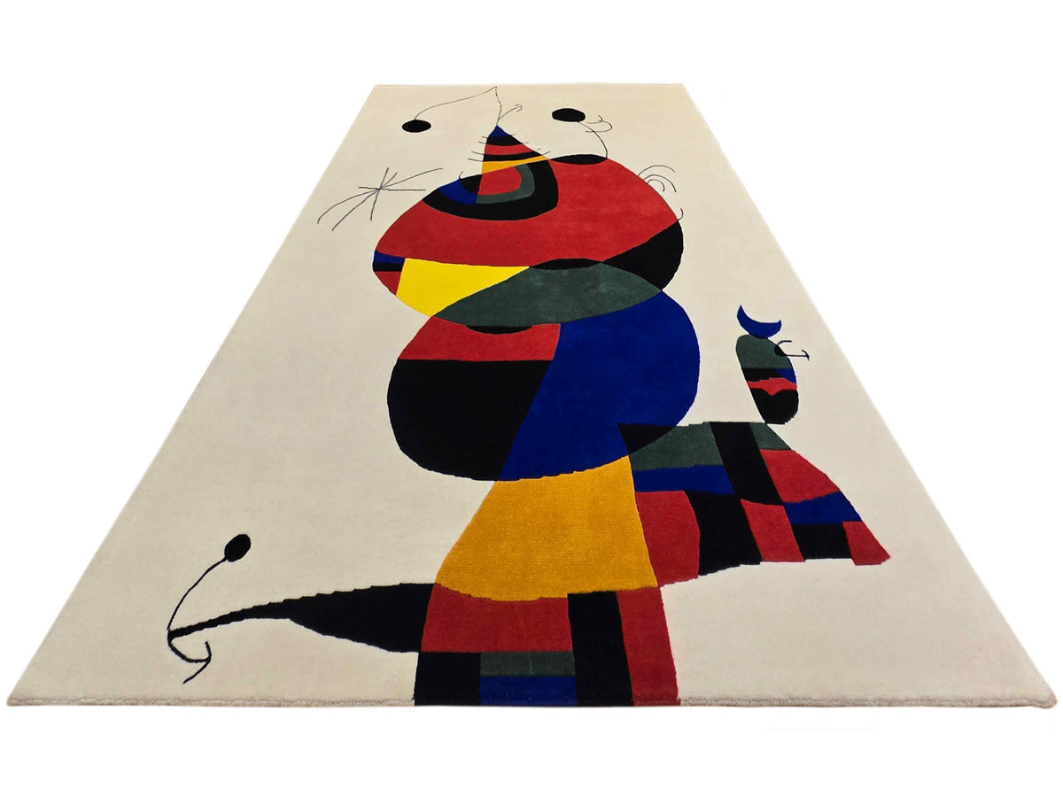 Abstract geometric area rug with off-white base and multicolor cat-and-dog figures