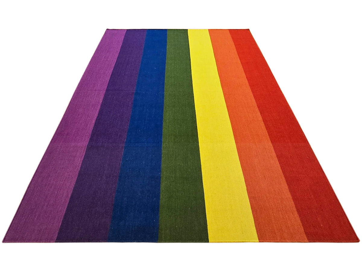 Striped rug with wide bands in purple, blue, green, yellow, and orange-red across the surface