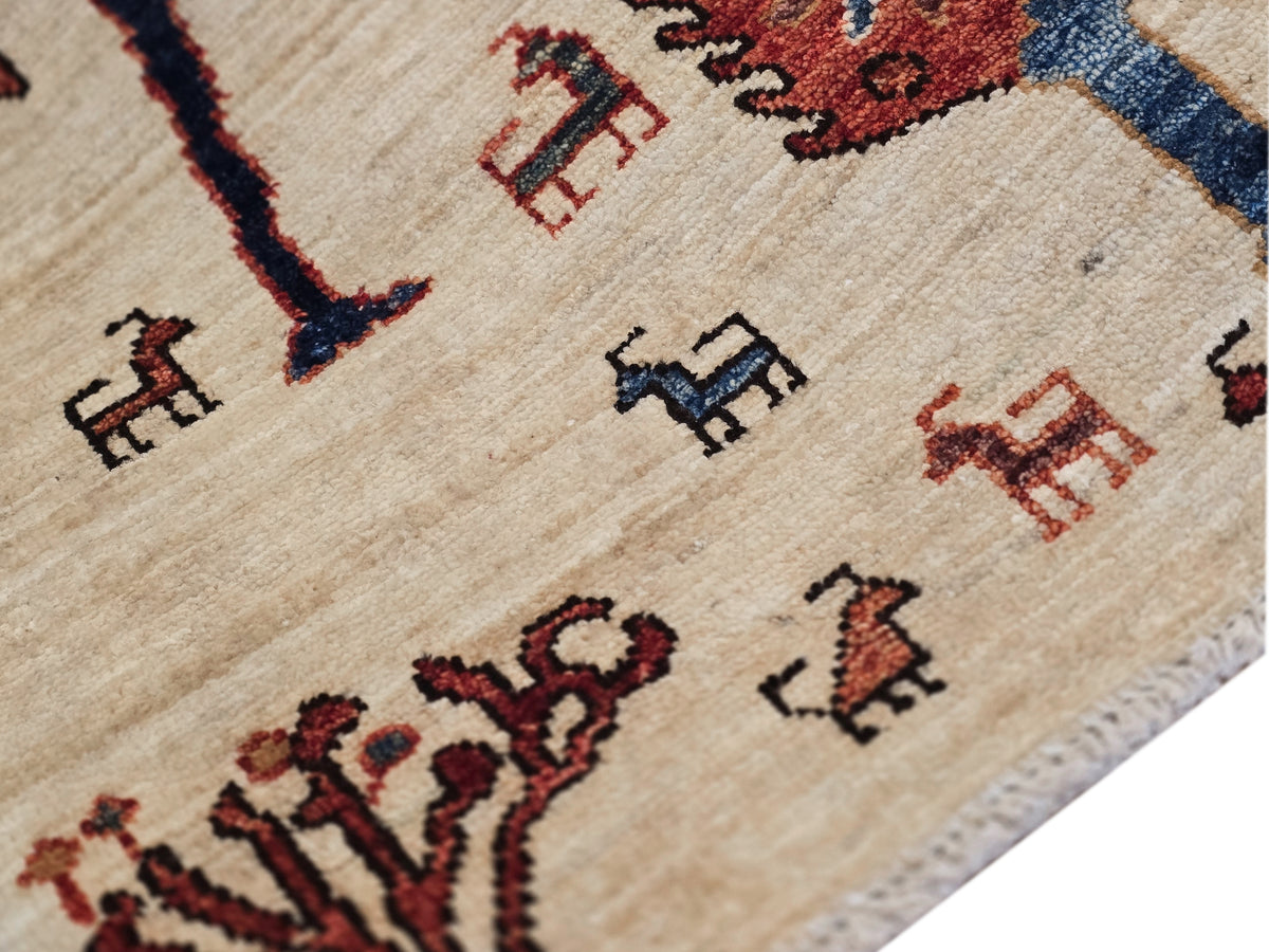 Rug detail showing cream background with scattered small animal icons in brown and red