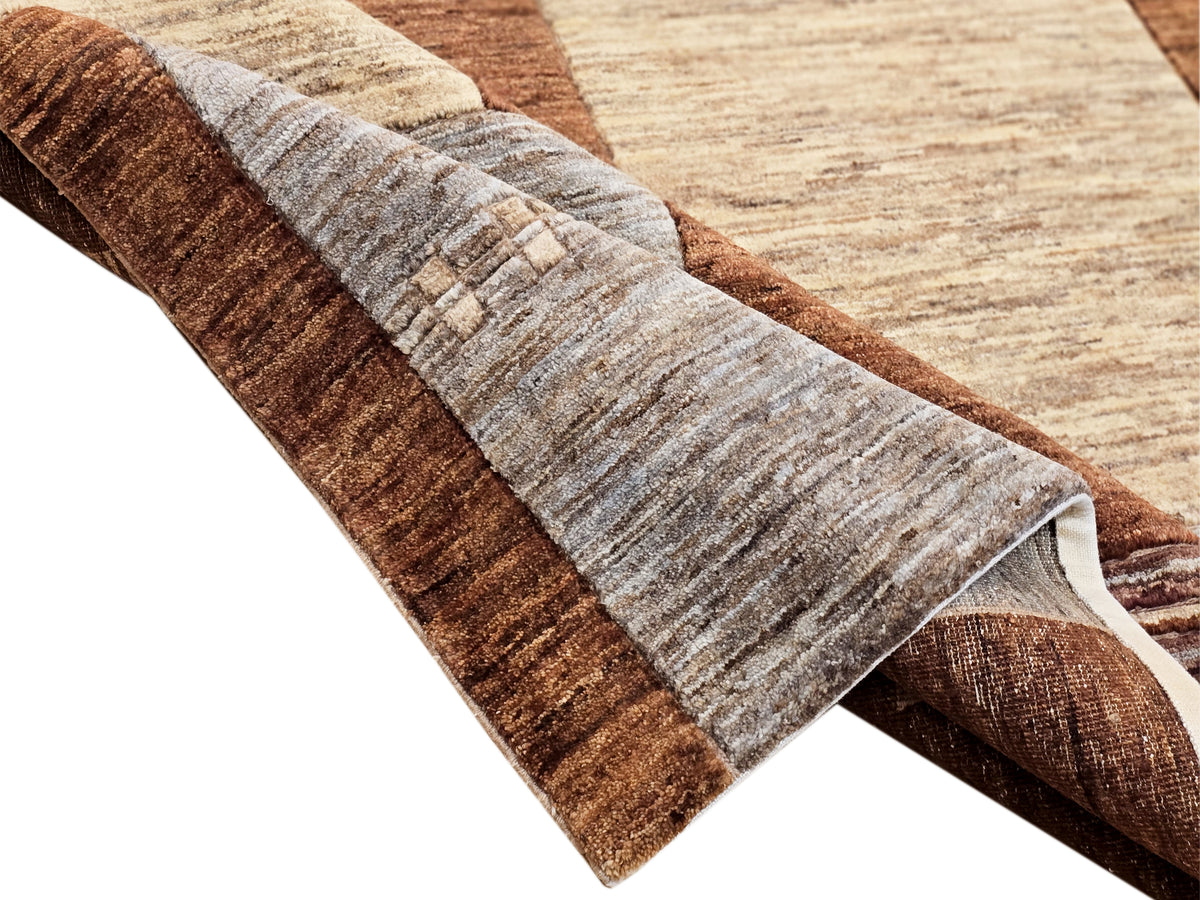 Folded area rug with brown and gray striped borders and beige insets