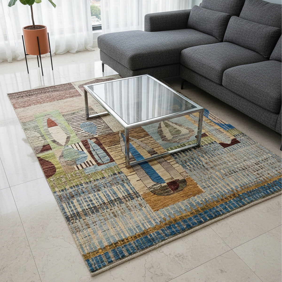 Multicolor geometric area rug placed in a room, featuring abstract shapes and fringe edge.
