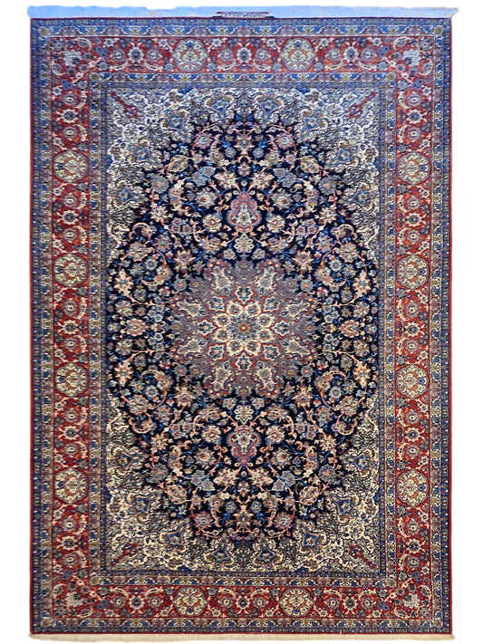 Persian-style rug with central floral medallion in blue, framed by red geometric border