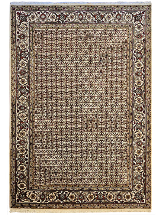 Rectangular area rug with repeating geometric lattice center and dark ornamental frame