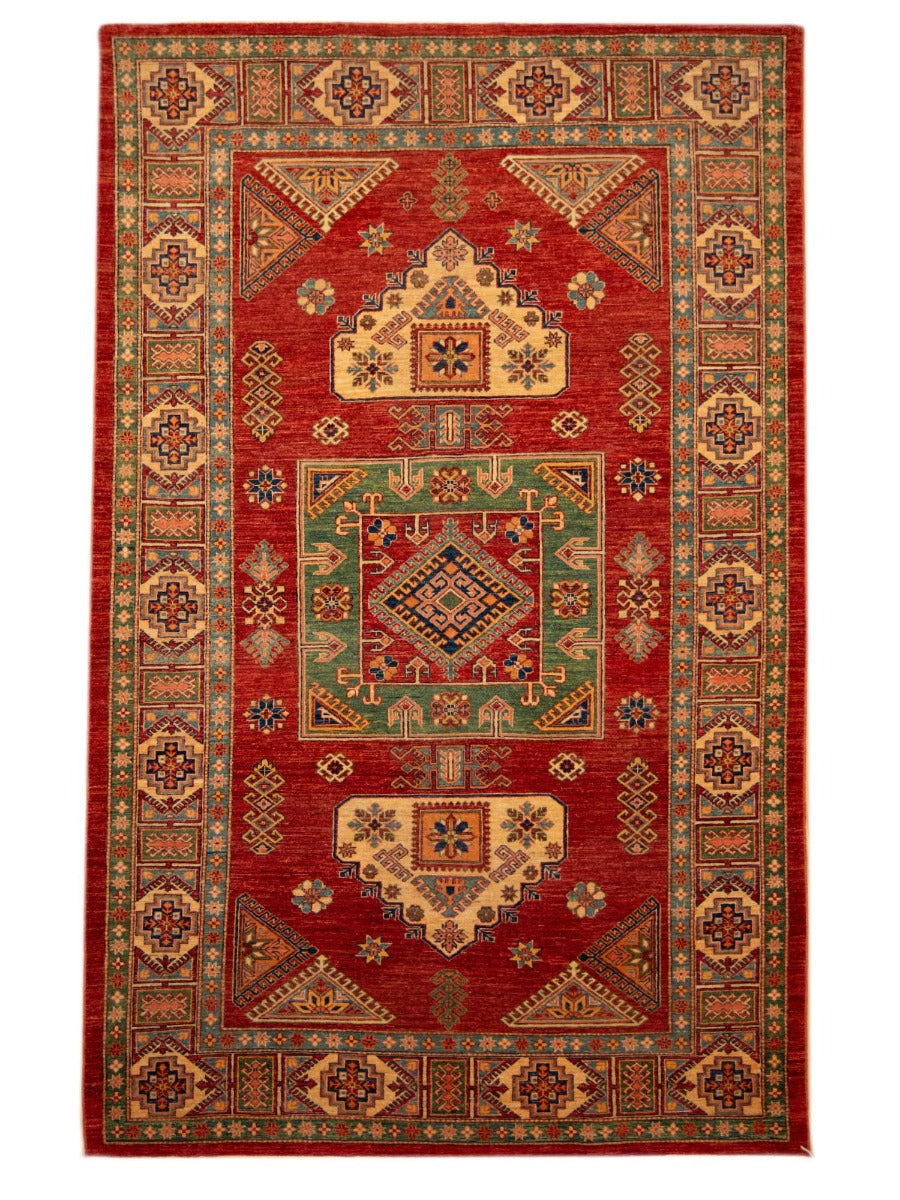 Red geometric area rug with central medallion and patterned border, 293x183 cm