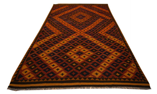 Kilim rug with geometric diamond lattice pattern, rust orange field and dark trim.