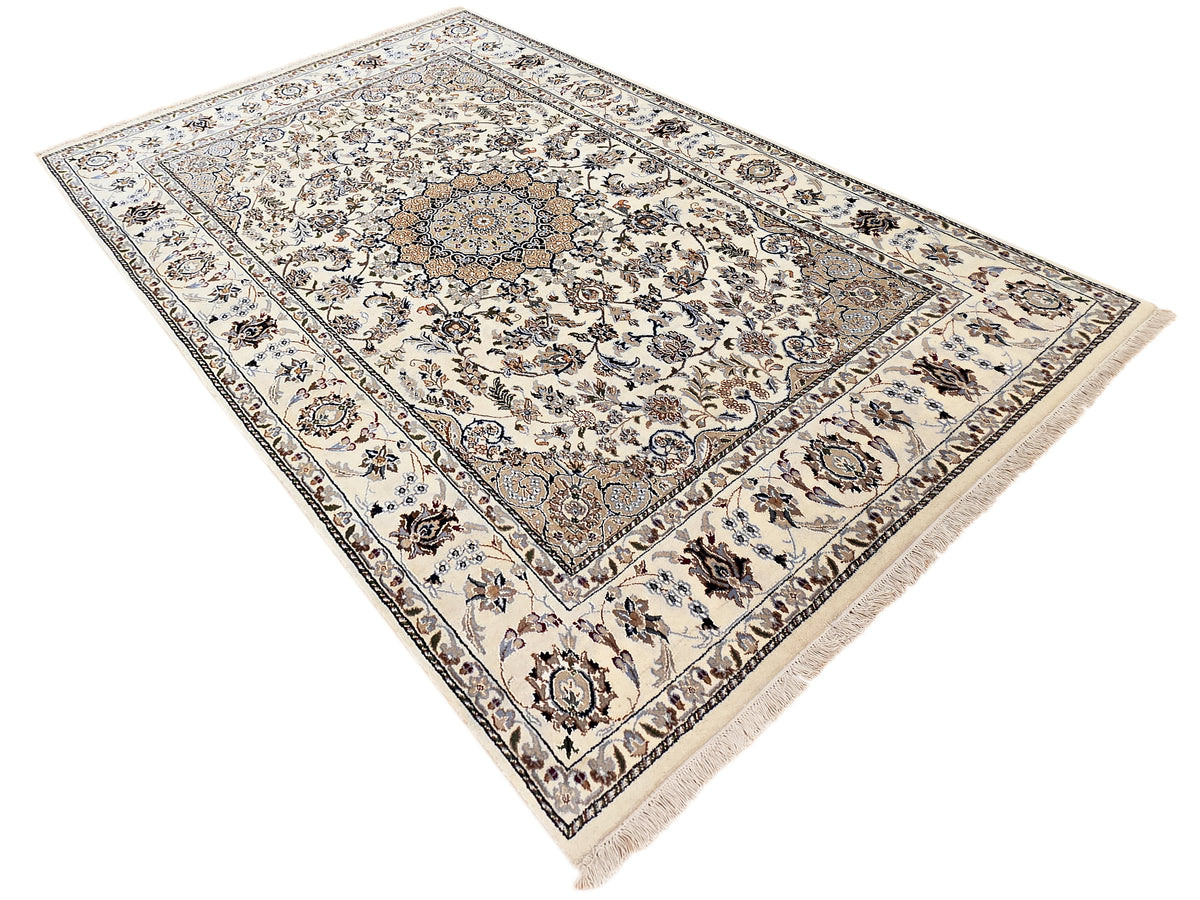 Nain rug with ivory geometric floral pattern and navy accents, short fringe on corners