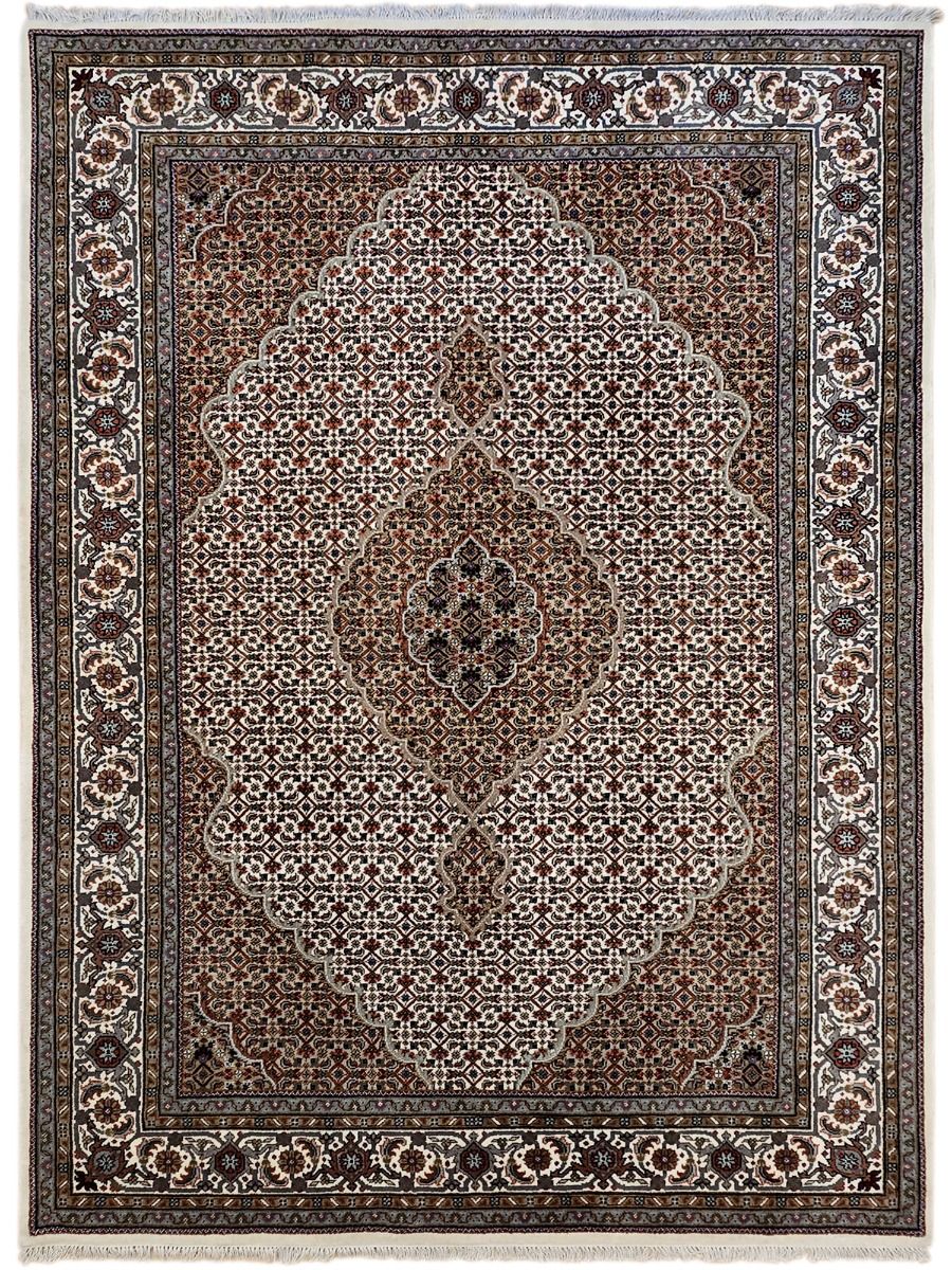 Oriental square rug with central floral medallion, brown and cream pattern, dark outer frame
