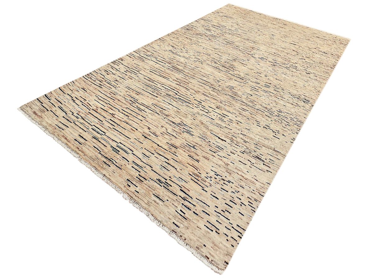 Corner view of Streepje Ziegler rug in beige with scattered blue-gray line details