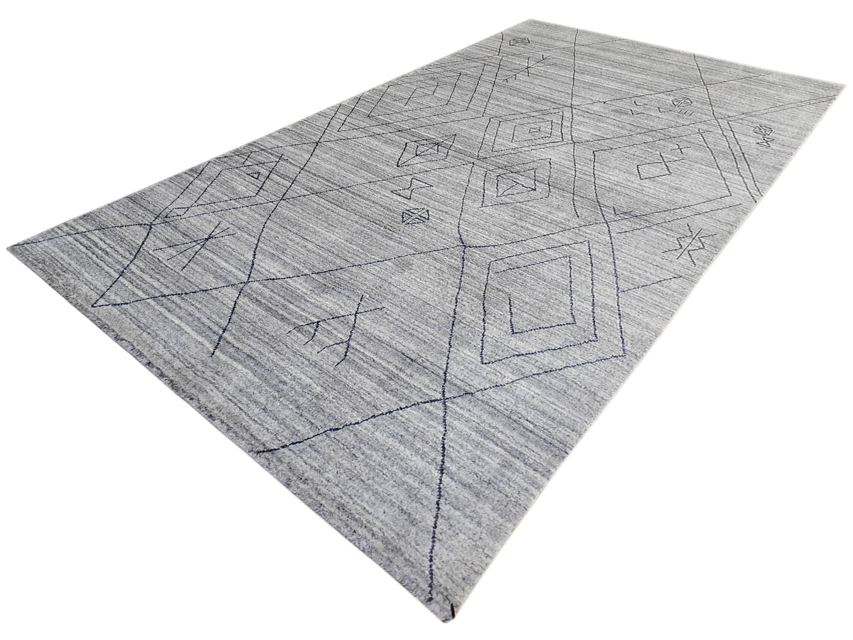 Gray handloom rug with minimal blue-gray geometric line pattern across center.