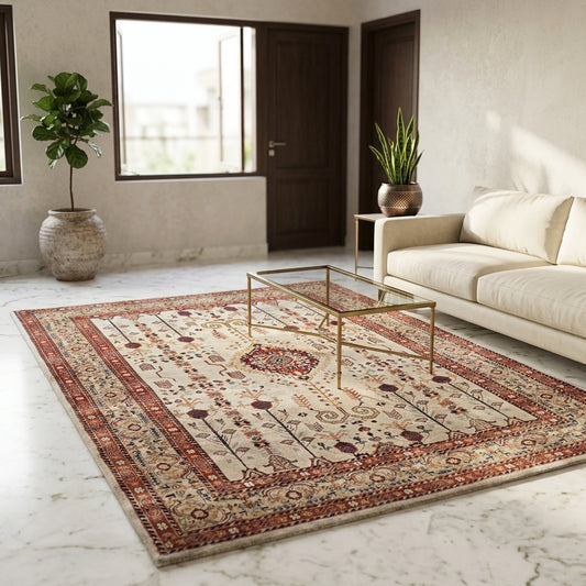 Rectangular rug with cream field, rust border, and symmetrical decorative motifs