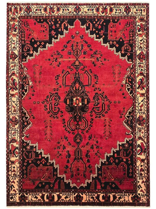 Red area rug with central hanging medallion, diamond accents, and ornate black-and-beige border