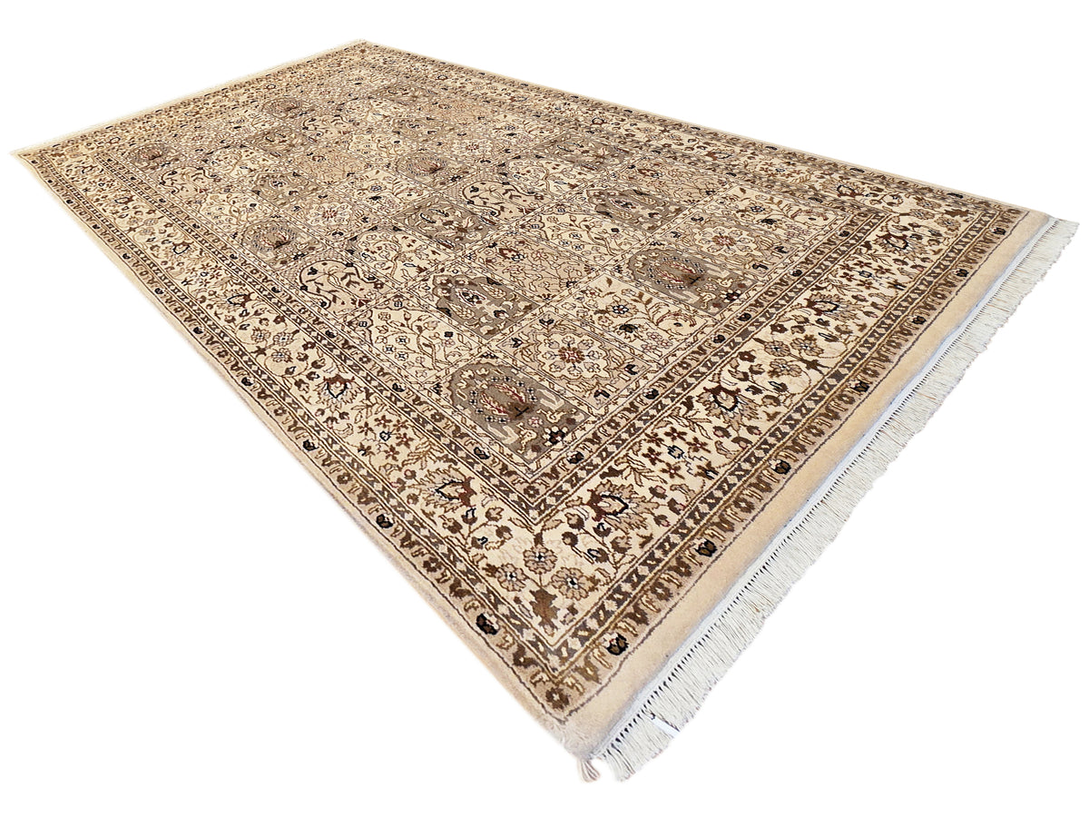 Bakhtiar rug corner angle with beige background, detailed center design, and light fringes.