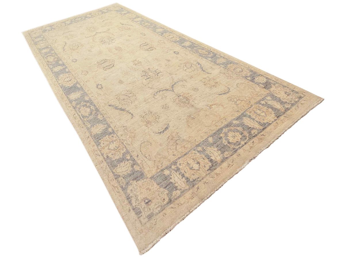 Beige and light blue Persian-style area rug with diagonal corner border details