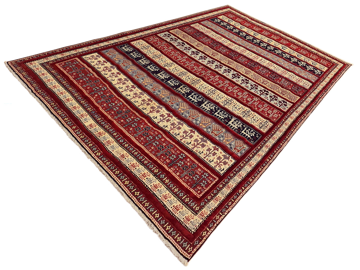 Rectangular rug with red, cream, and navy stripes and repeating motifs