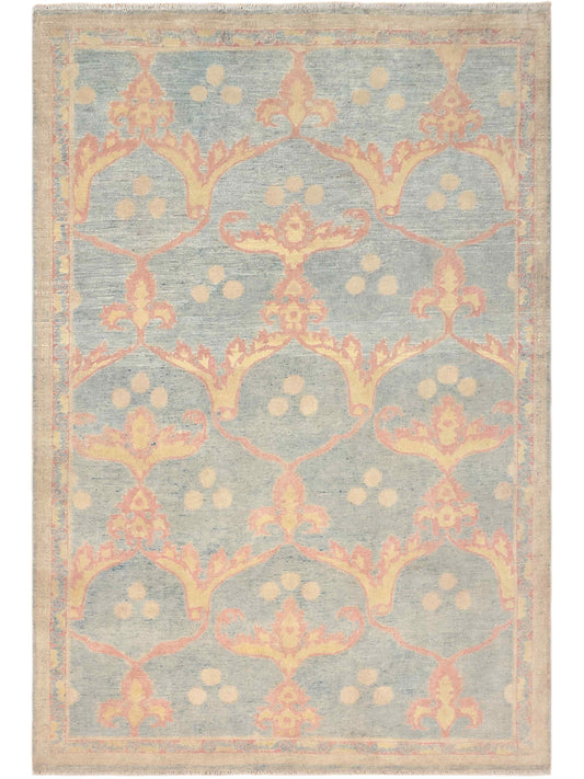 Rectangular light blue-gray rug with coral floral medallion pattern, distressed finish