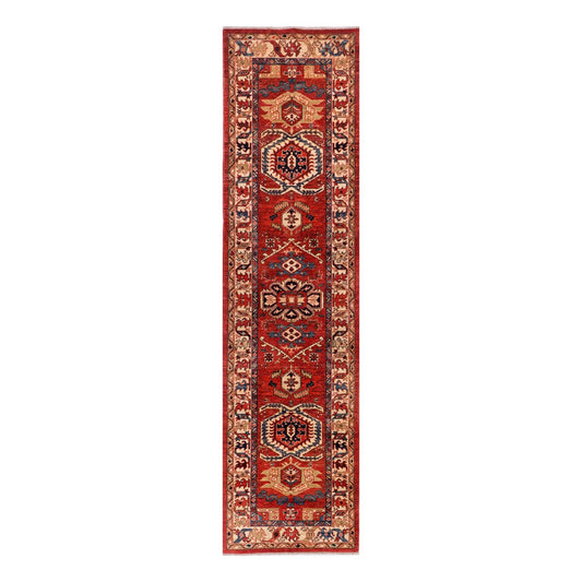 Red Kazak runner rug with ornate cream and navy medallion pattern